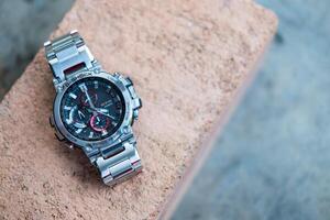 Bangkok, Thailand - February 3, 2024 G-Shock model MTG-B1000D-1ADR design stainless steel. photo