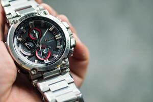 Bangkok, Thailand - February 3, 2024 G-Shock model MTG-B1000D-1ADR design stainless steel is tough watch and luxury. photo