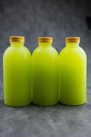 Three tasty healthy guava juice bottles with no brand for commercial advertisement text. photo