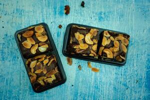 Chocolate brownie in a box. The taste is sweet and delicious photo