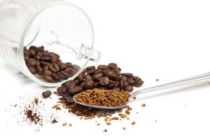 Macro shot of instant granules and beans coffee on a white photo