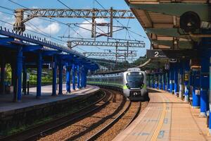 train approaching Badu railway station at badu township in keelung, taiwan photo