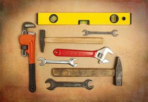 Various tools to work with, hammer, spanner, gas wrench, level to measure the level photo