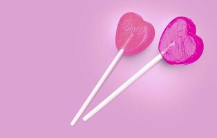 Two Pink Valentine's day heart shape lollipop candy photo