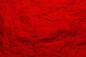 Crumpled craft red color paper texture photo