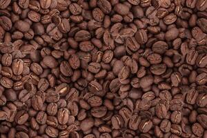 Roasted coffee beans background. photo