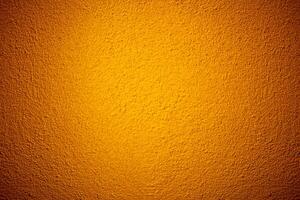 Orange color grunge cement wall texture background photo