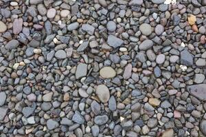 Wet pebble, rocks background photo