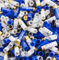 Background of many colorful shot empty shotgun shells photo