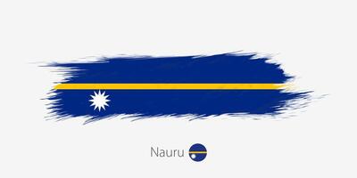 Flag of Nauru, grunge abstract brush stroke on gray background. vector