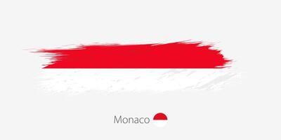 Flag of Monaco, grunge abstract brush stroke on gray background. vector