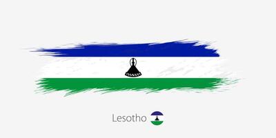 Flag of Lesotho, grunge abstract brush stroke on gray background. vector