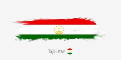Flag of Tajikistan, grunge abstract brush stroke on gray background. vector