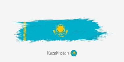 Flag of Kazakhstan, grunge abstract brush stroke on gray background. vector