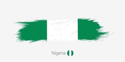Flag of Nigeria, grunge abstract brush stroke on gray background. vector