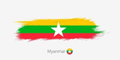 Flag of Myanmar, grunge abstract brush stroke on gray background. vector