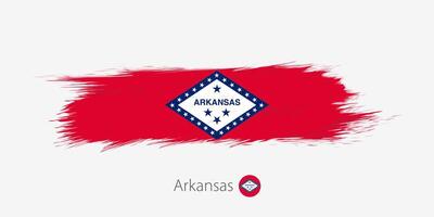 Flag of Arkansas US State, grunge abstract brush stroke on gray background. vector