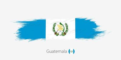 Flag of Guatemala, grunge abstract brush stroke on gray background. vector