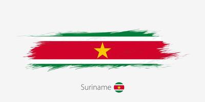 Flag of Suriname, grunge abstract brush stroke on gray background. vector