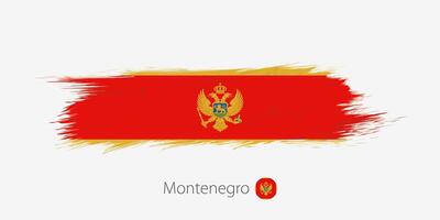 Flag of Montenegro, grunge abstract brush stroke on gray background. vector