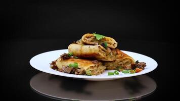 fried thin pancakes stuffed with meat and mushrooms. video