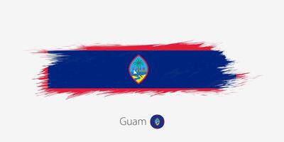 Flag of Guam, grunge abstract brush stroke on gray background. vector