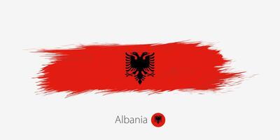 Flag of Albania, grunge abstract brush stroke on gray background. vector