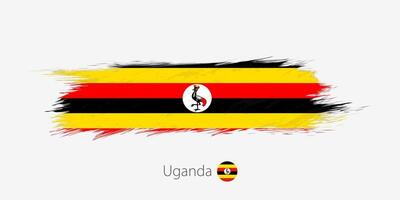 Flag of Uganda, grunge abstract brush stroke on gray background. vector