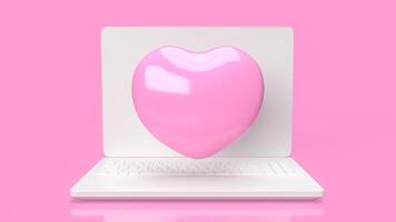 The laptop and pink hearth  for Technology or medical  concept 3d rendering. photo