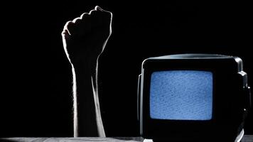 Closed Fist Of a Man And Static Tv For Black History Month photo