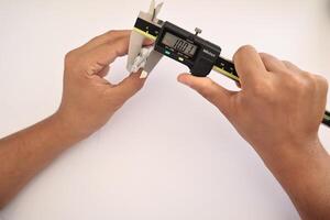 insulated digital caliper on white background photo