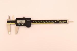 insulated digital caliper on white background photo