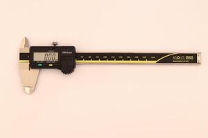 insulated digital caliper on white background photo