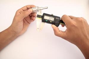 insulated digital caliper on white background photo