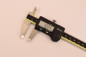 insulated digital caliper on white background photo