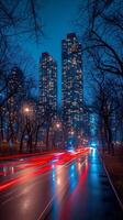 AI generated Twilight cityscape with glowing high-rises and traffic light trails photo