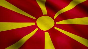 realistisch vlag van Macedonië Aan de golvend oppervlakte van kleding stof. vlag van de republiek van Macedonië achtergrond video