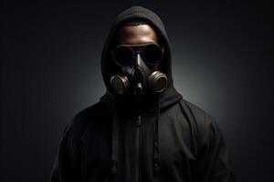 AI generated Modern creative post-apocalyptic fashion concept. Front view of black stylish male model in glasses, gas mask and hooded hoodie on dark background. Generative AI photo