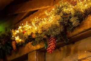 string of lights between artificial pine needles photo