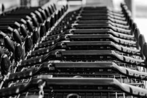 stacked shopping trolleys in selective focus photo