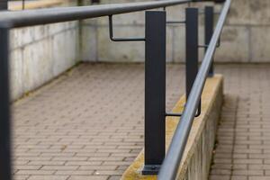 a railing on a footpath photo