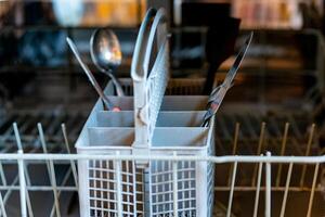 a dishwasher with cutlery basket photo