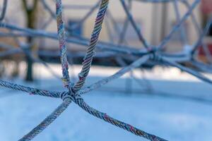 climbing frame made of ropes in winter photo
