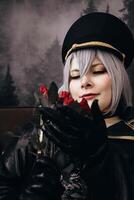 dominant woman in black uniform with a rose in her hand photo