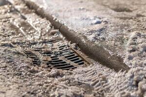 icy gully cover with footpath in winter photo