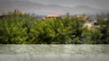 Blank marble table with naturally blurred background. Good for product arrangement photo