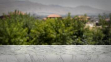 Blank marble table with naturally blurred background. Good for product arrangement photo