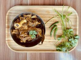 Traditional Homemade Healthy Mutton Curry and Mutton Kosha, non-vegetarian food concept, Top View . Vancouver, British Columbia, Canada - January 14, 2024 photo