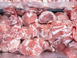 The pork collar sliced in the metal tray. photo