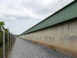 The barbed wire fence surrounds the water storage building. photo